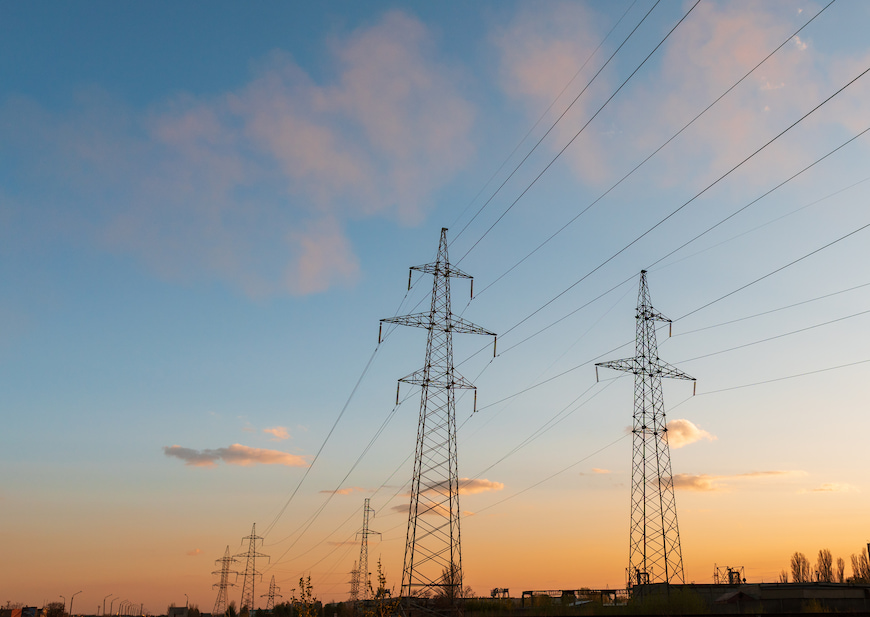 An image of a power grid at sunset