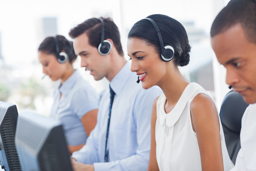 Several employees at a call centre answering calls at the same time.