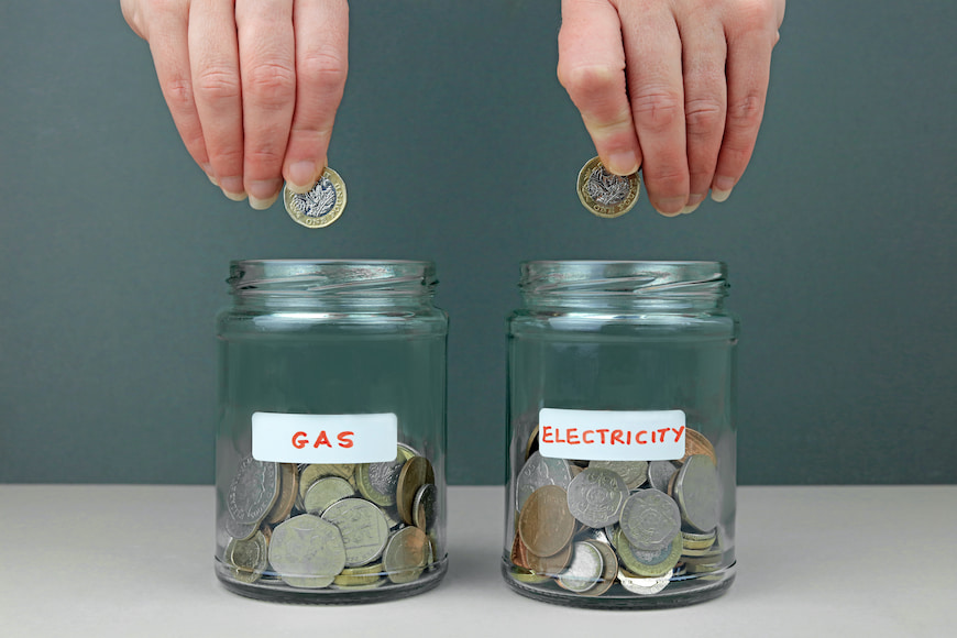 electricity and gas jar with coins