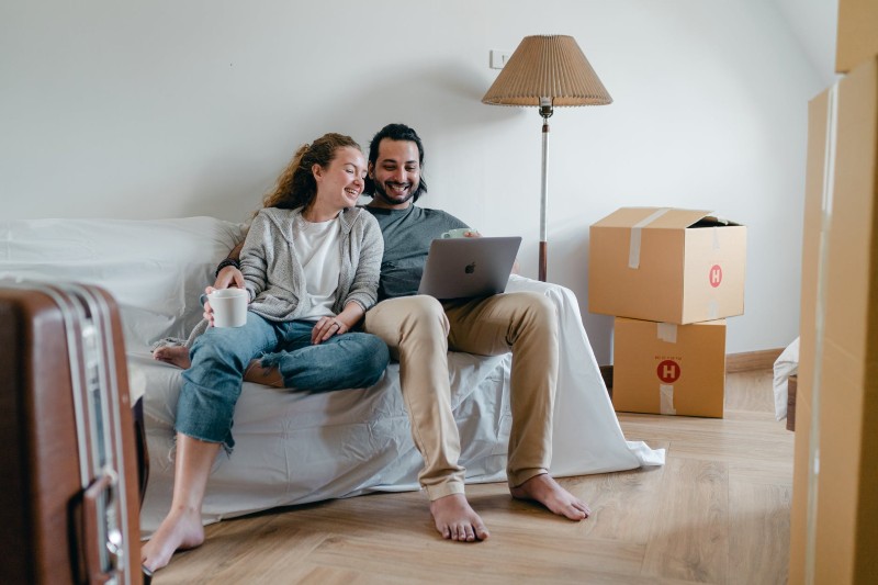 couple on couch while moving in