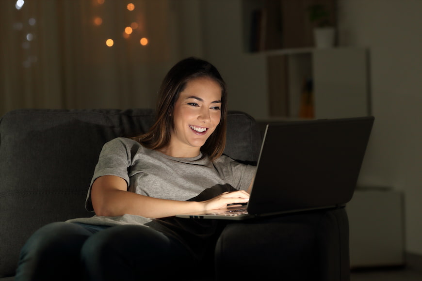 Woman on her laptop smiling