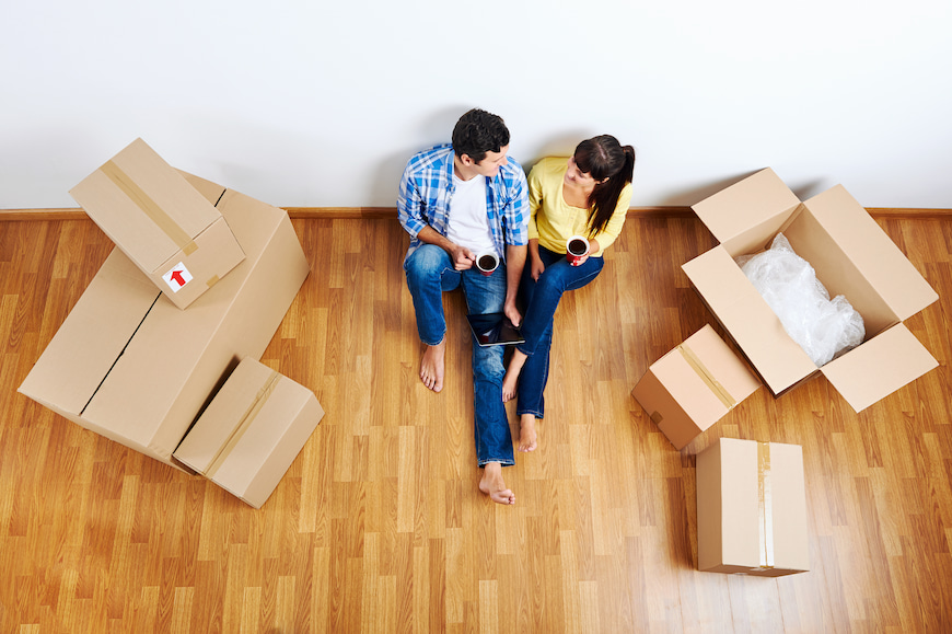 Moving house switch broadband providers - couple who just moved with boxes