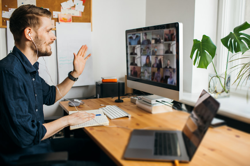 Man working from home at his desk in a video conference