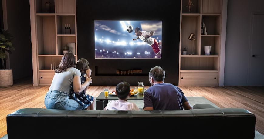 Family watching tv with brandband tv deals