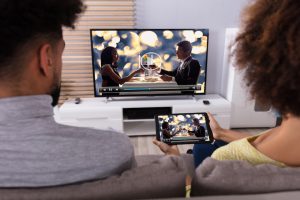 TV and ipad being used together with broadband bundle plan